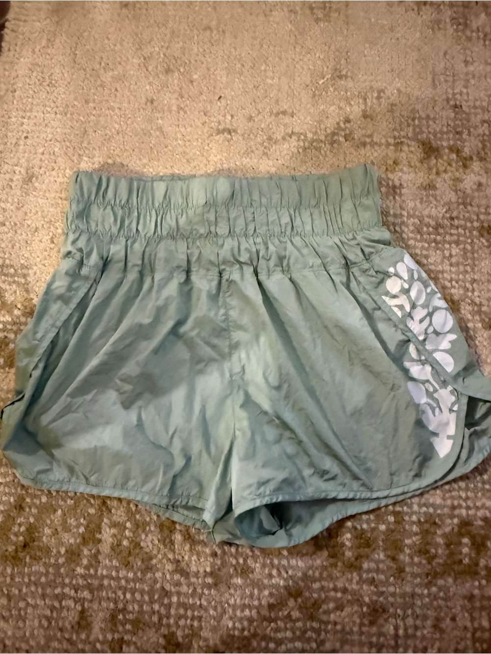 FP Movement by Free People Sage Green Athletic Shorts with White Floral Accent